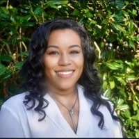 Melissa Pennington, CEO & Founder, HR On Demand seen with shoulder length curly hair style